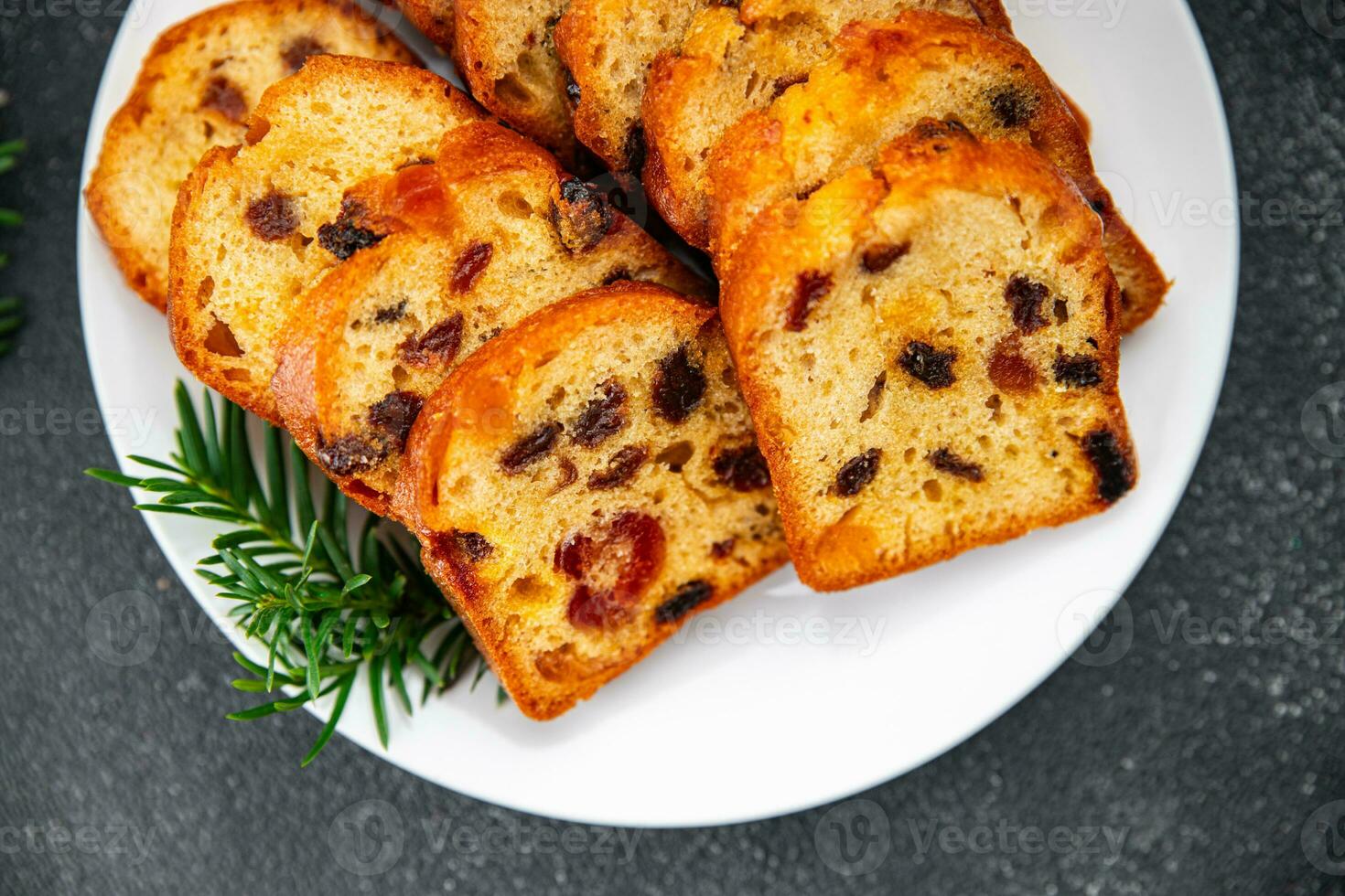 fruit cake pastry dried fruits cherries, dried apricots, prunes, raisins sweet Christmas sweet dessert holiday treat new year and christmas meal food snack on the table copy space food background photo