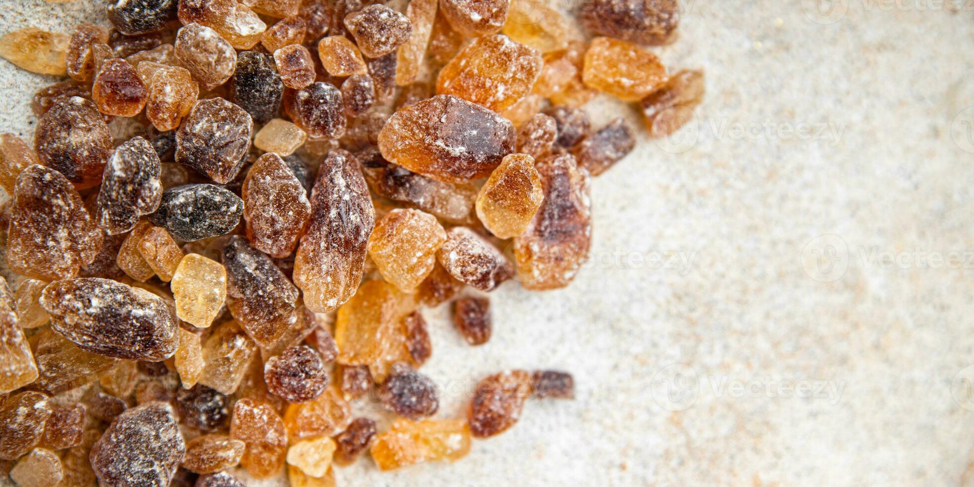 cane sugar crystal rock pieces candy brown sugar candied big rock caramel crystals sugar  taste eating cooking appetizer meal food snack on the table copy space food background rustic top view photo