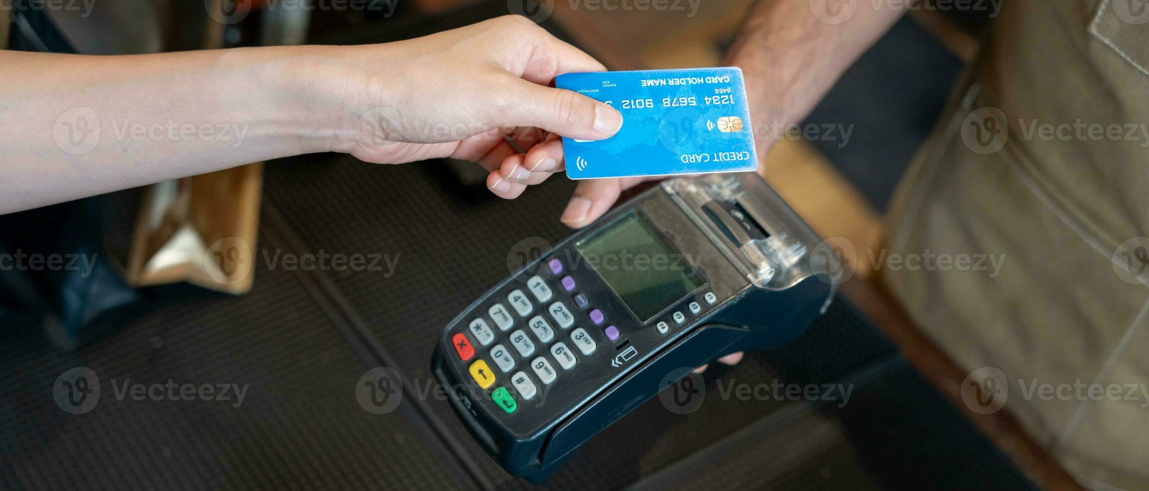 Woman use credit card pay money online in cafe restaurant with a digital payment without cash. accumulate discount. E wallet, technology, pay online, credit card, bank app. daily life payment photo