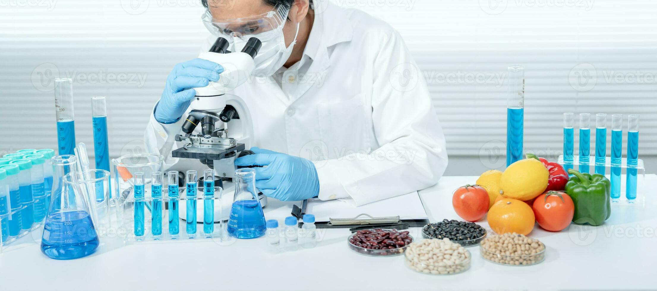 Scientist check chemical food residues in laboratory. Control experts inspect quality of fruits, vegetables. lab, hazards, ROHs, find prohibited substances, contaminate, Microscope, Microbiologist photo
