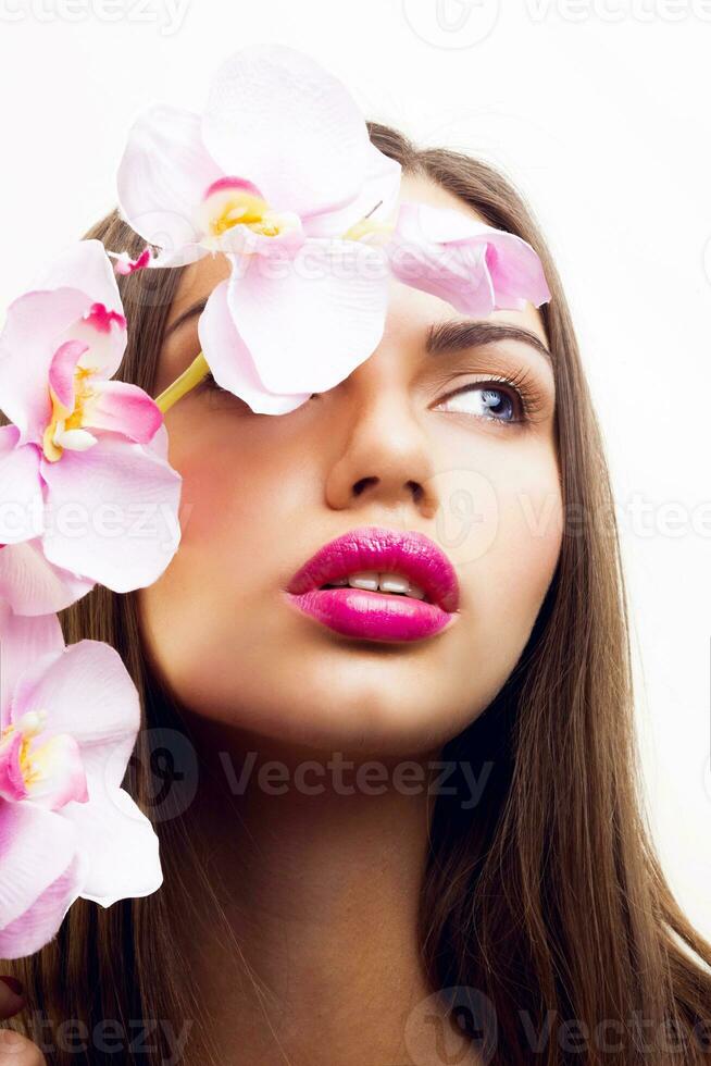 Beauty spring  portrait of tender seductive lady with pink flowers, big lips and natural make up. photo