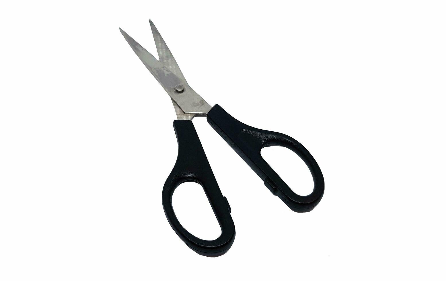 Black scissors isolated on white background with clipping path. Used tool, Old equipment and Sharp object photo