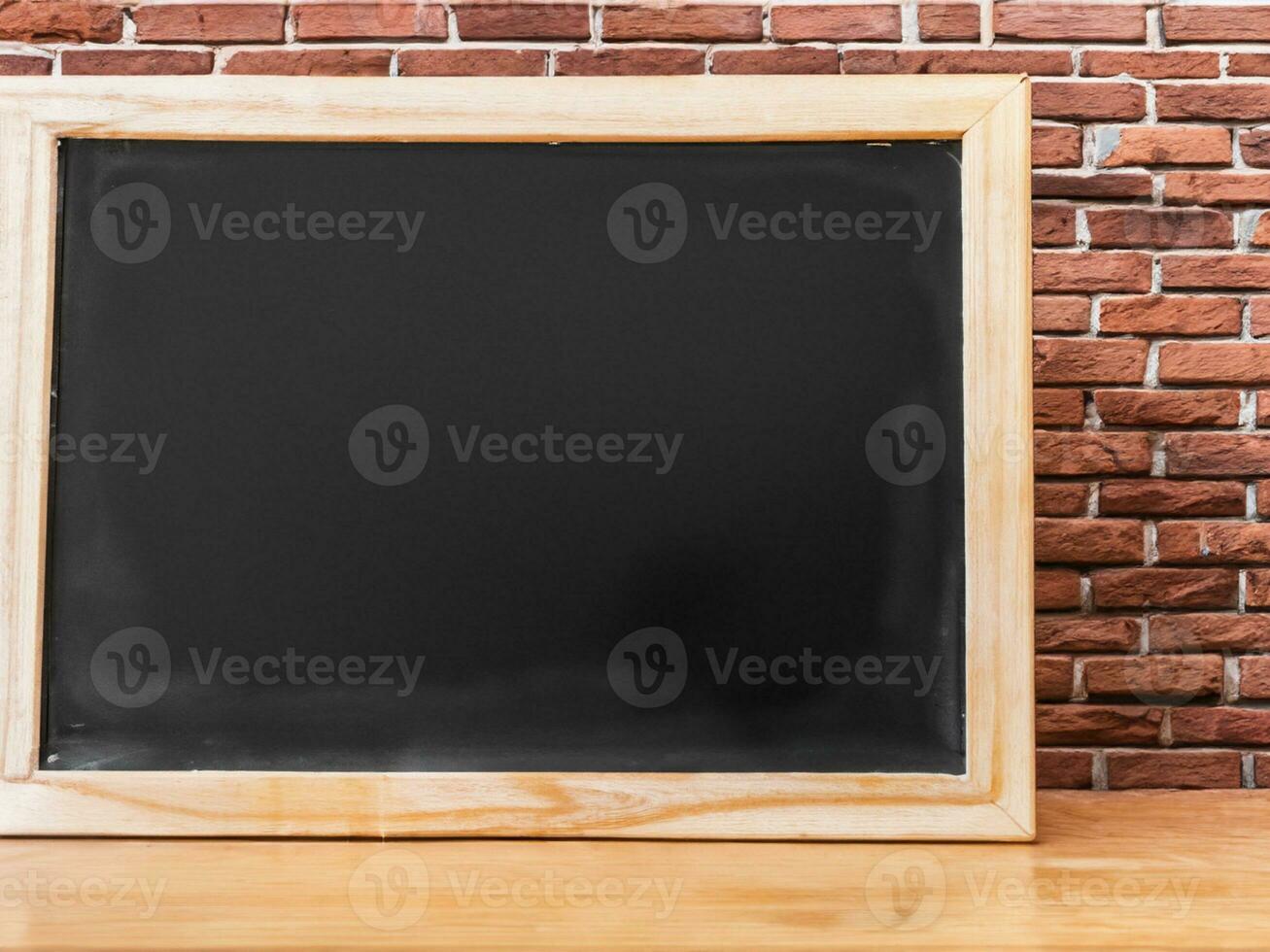 blackboard on brick wall background, mock up for your text photo