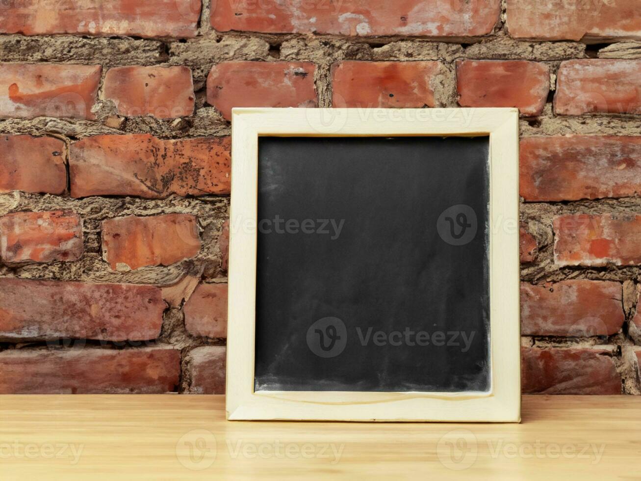 blackboard on brick wall background, mock up for your text photo