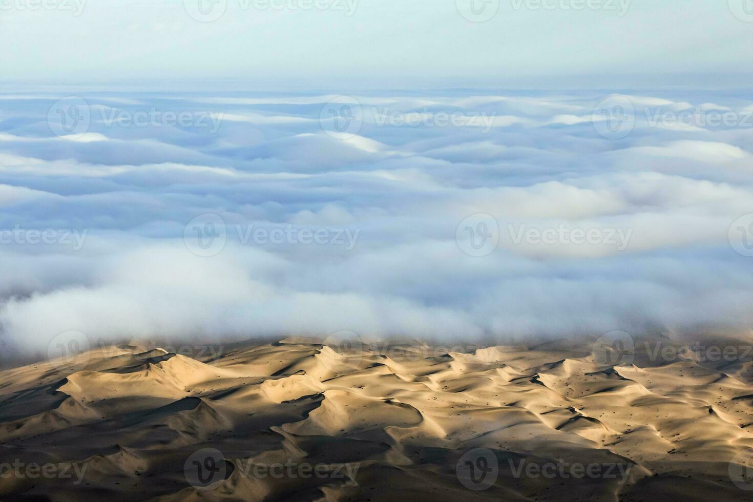 An Aerial view over the vast sand dunes that make up the great sand sea in Namibia. photo