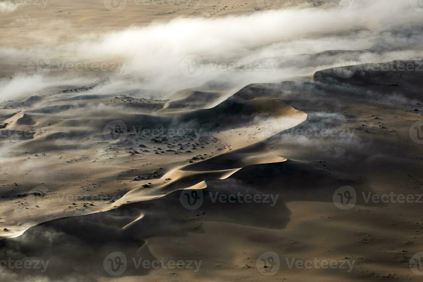 An Aerial view over the vast sand dunes that make up the great sand sea in Namibia. photo