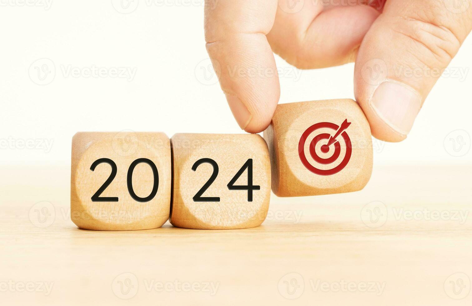 2024 business goals concept. Wooden blocks with 2024 number and goal target icon. Copy space photo