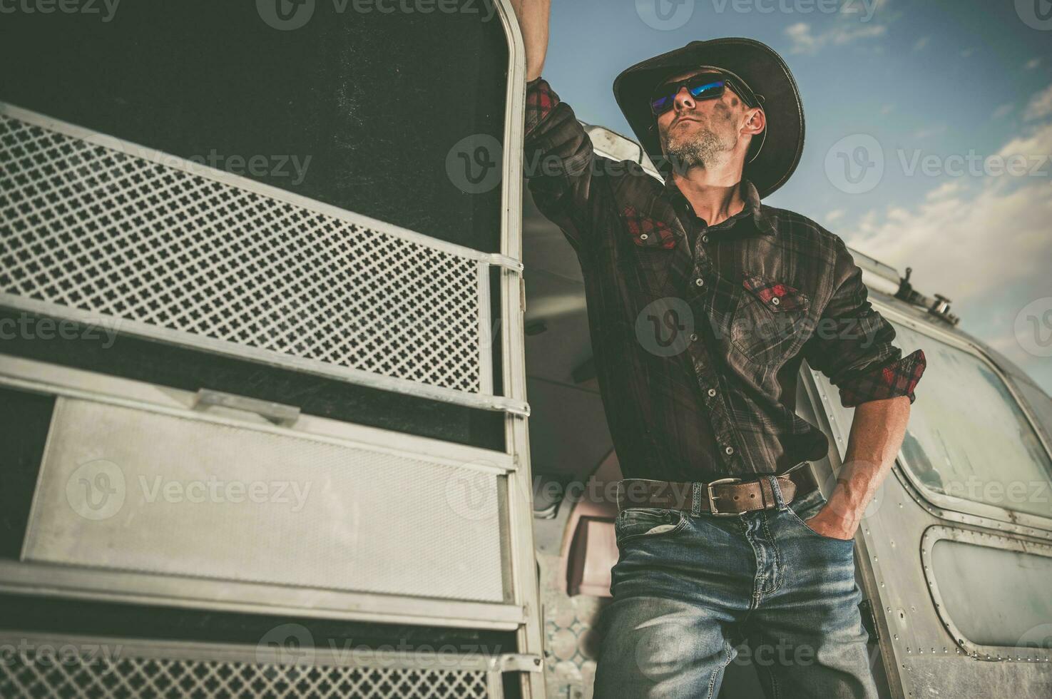 American Cowboy Staying in His Travel Trailer Doors photo