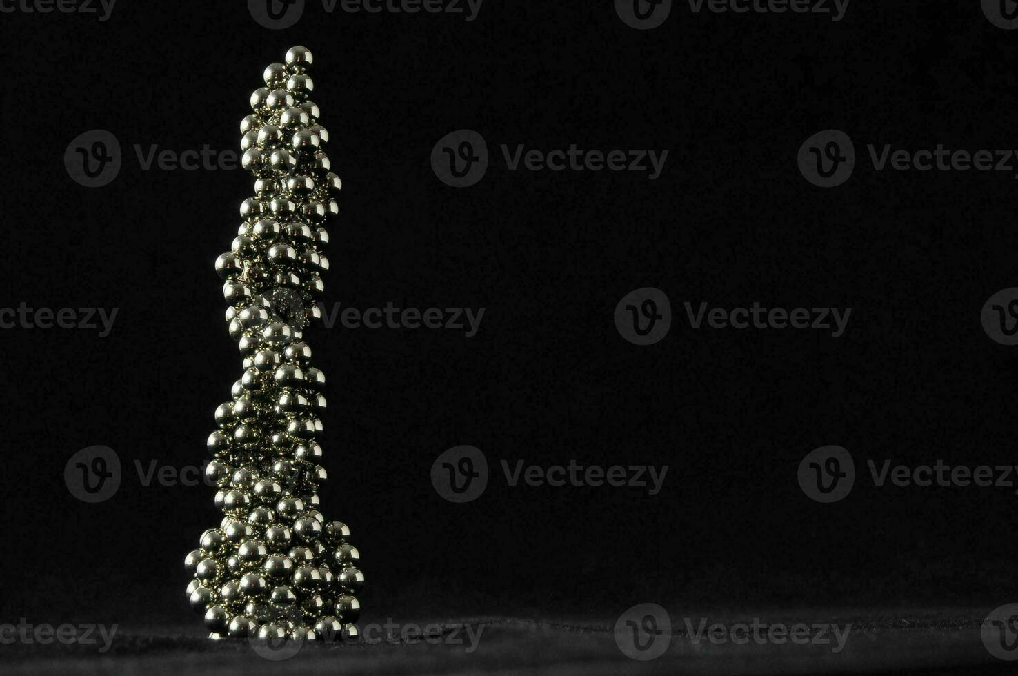 Metal beads on black background photo