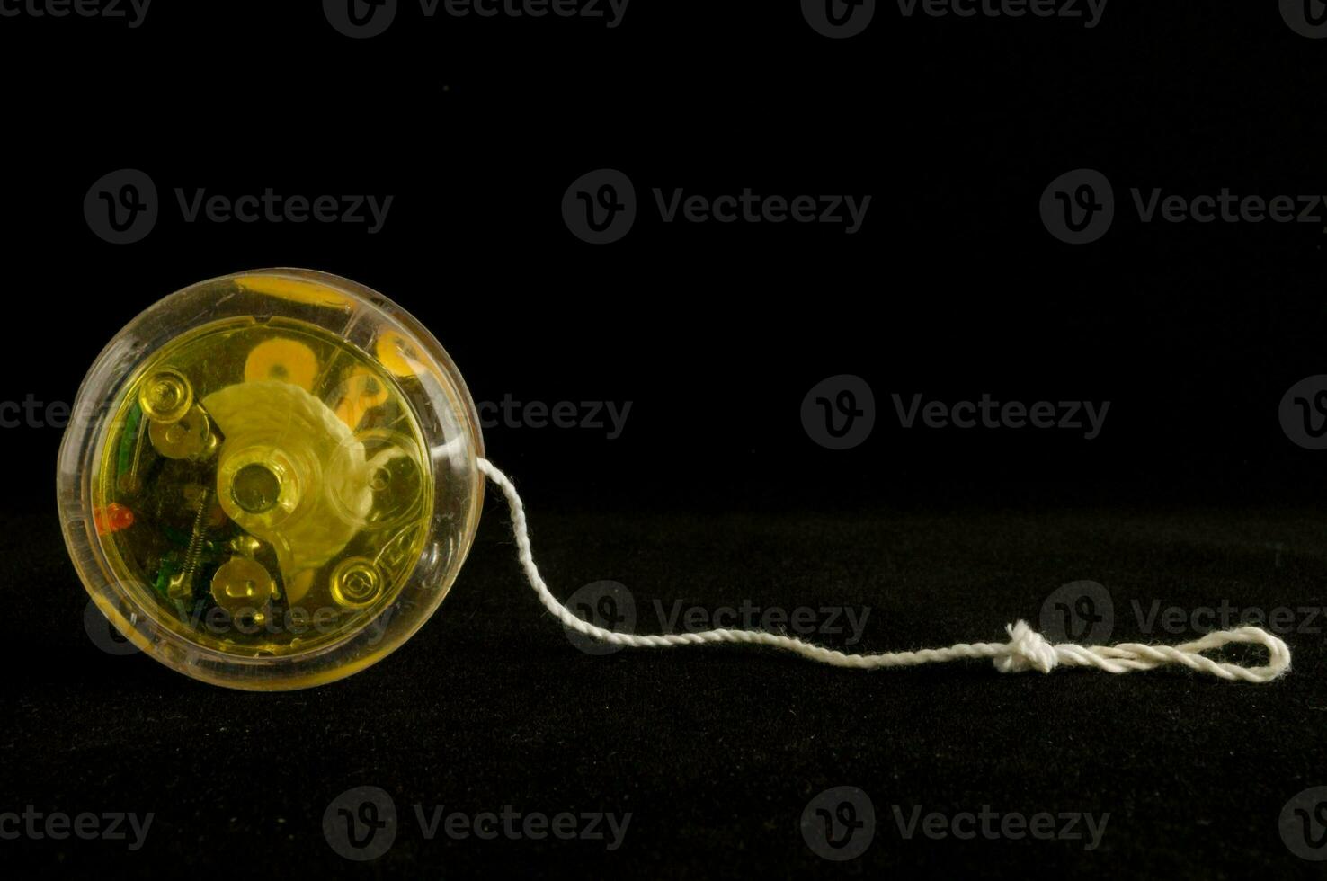 A yo-yo on black background photo