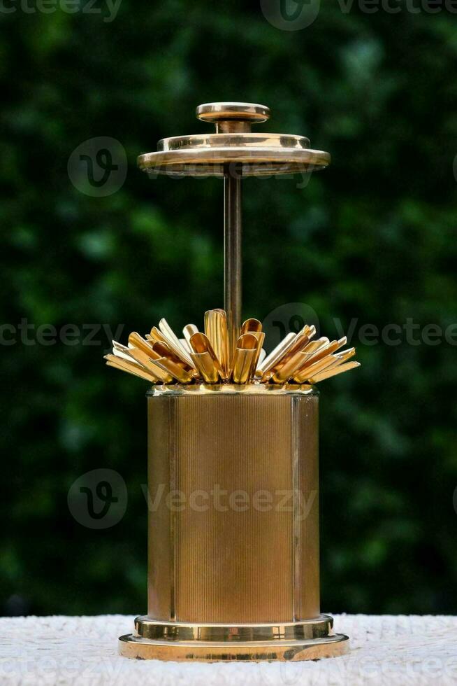 a brass cigarette holder photo