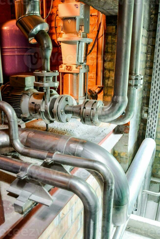 pipes and valves in a factory photo