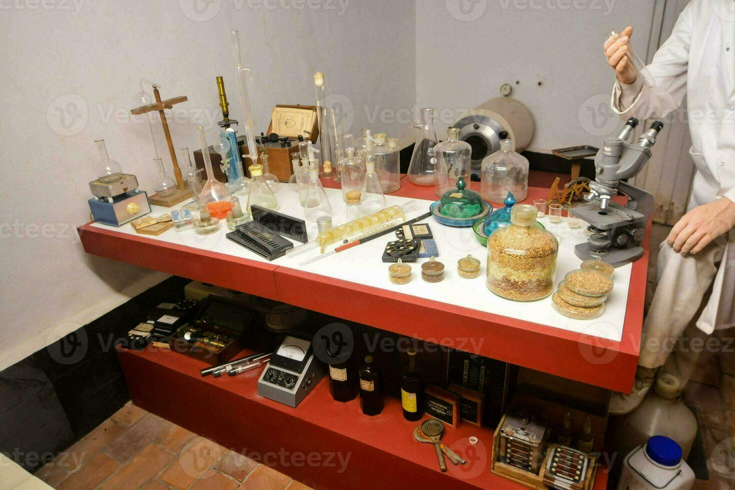 a man standing in front of a table with various items photo