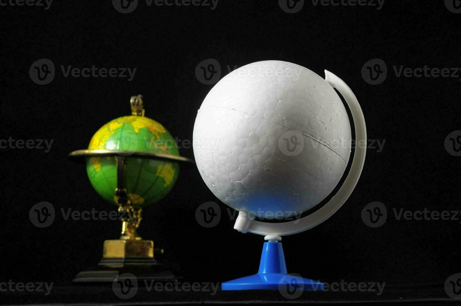 Globes on black background photo