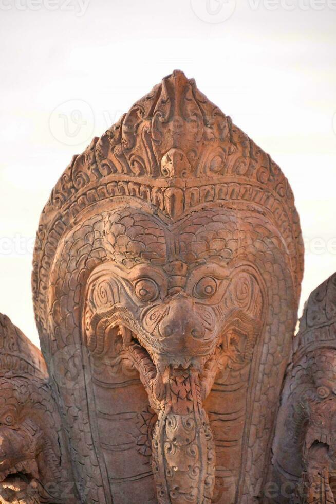 a large stone sculpture of a dragon photo