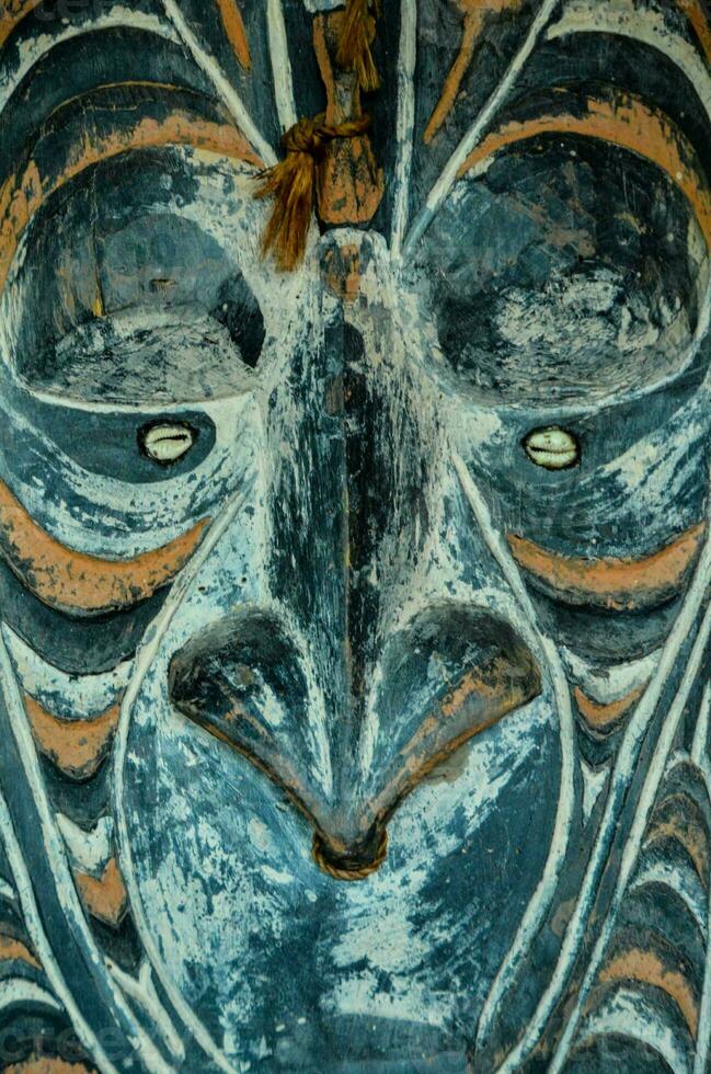 a close up of a mask with a face photo