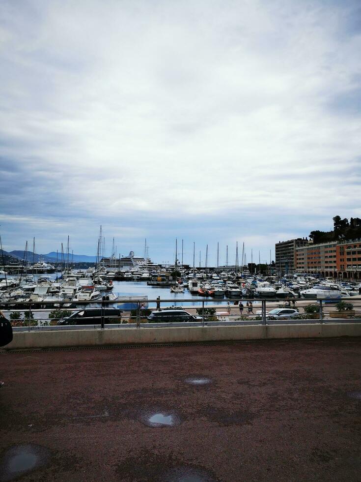 Photo of a marina filled with boats under a cloudy sky