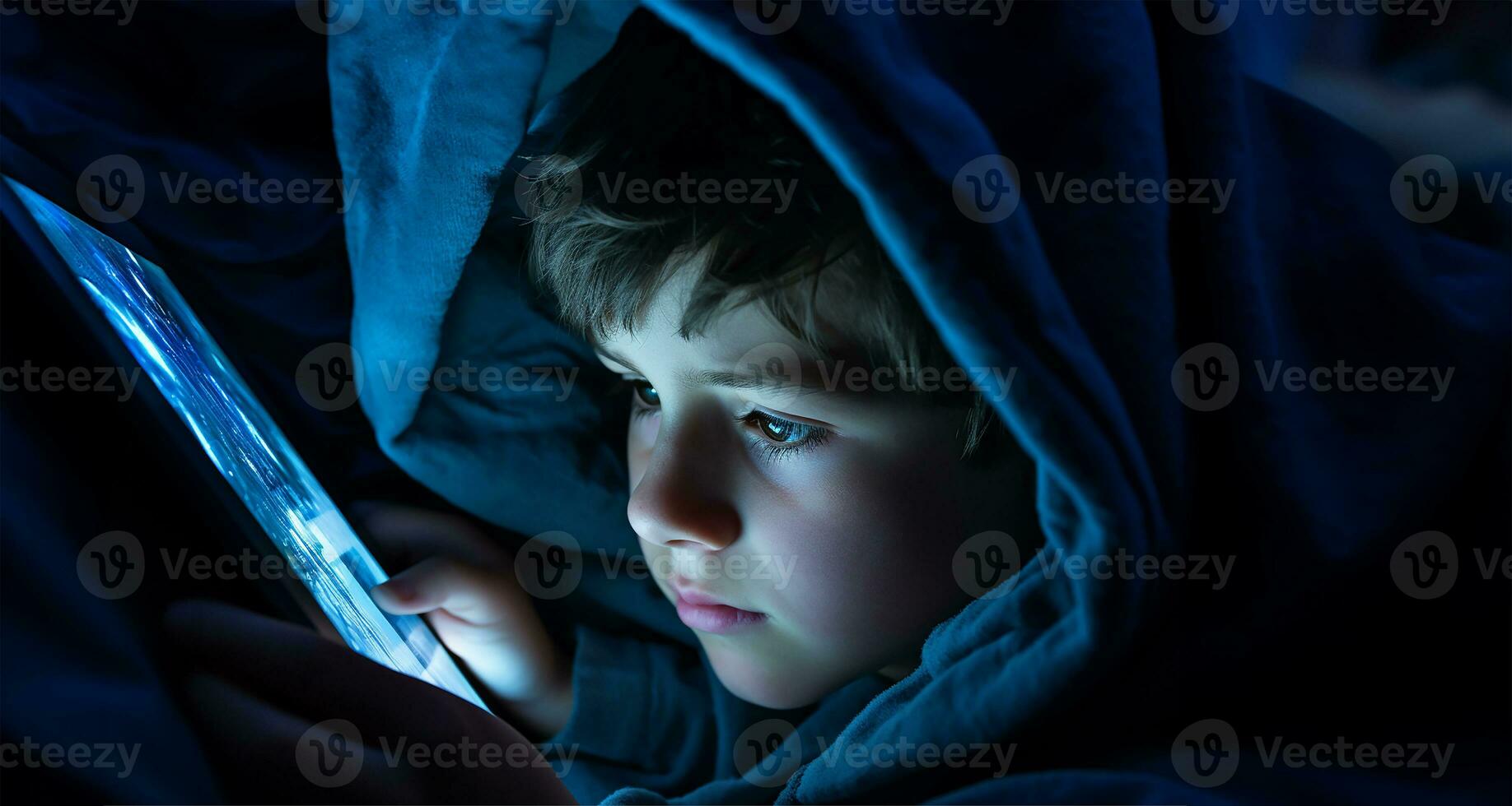 young boy engrossed in a tablet or mobile screen with a blanket draped over his head. AI Generated photo