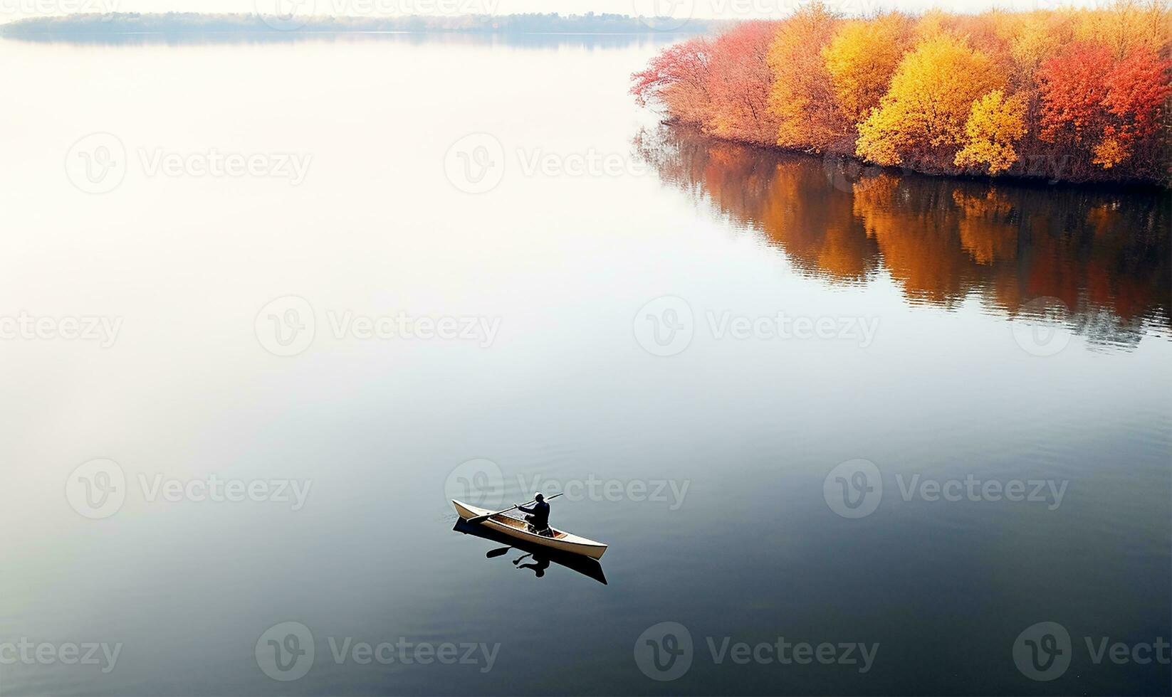 Aerial view of a person rowing on a calm lake in autumn. AI Generated photo