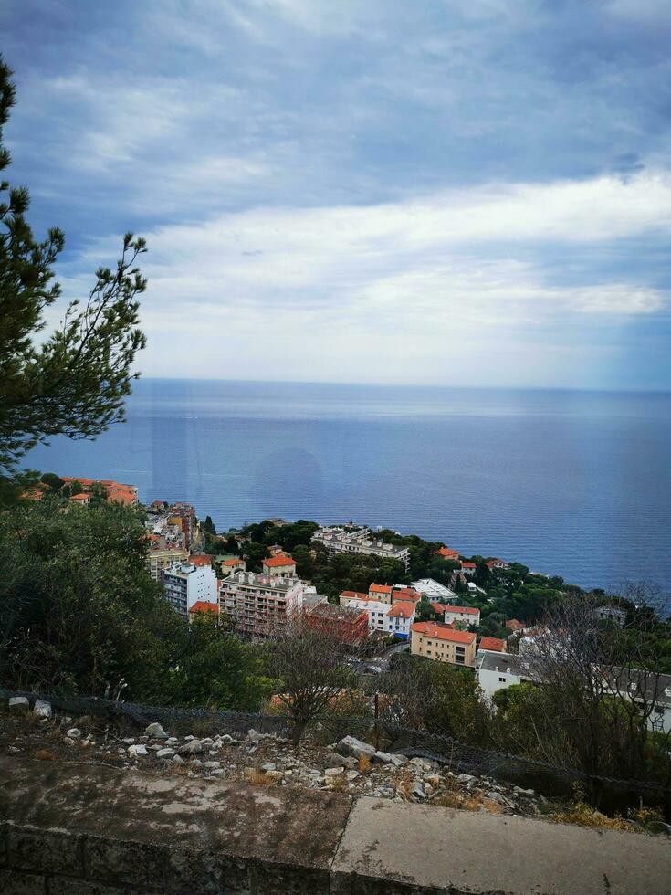 Photo of the breathtaking view of the ocean from atop a majestic hill