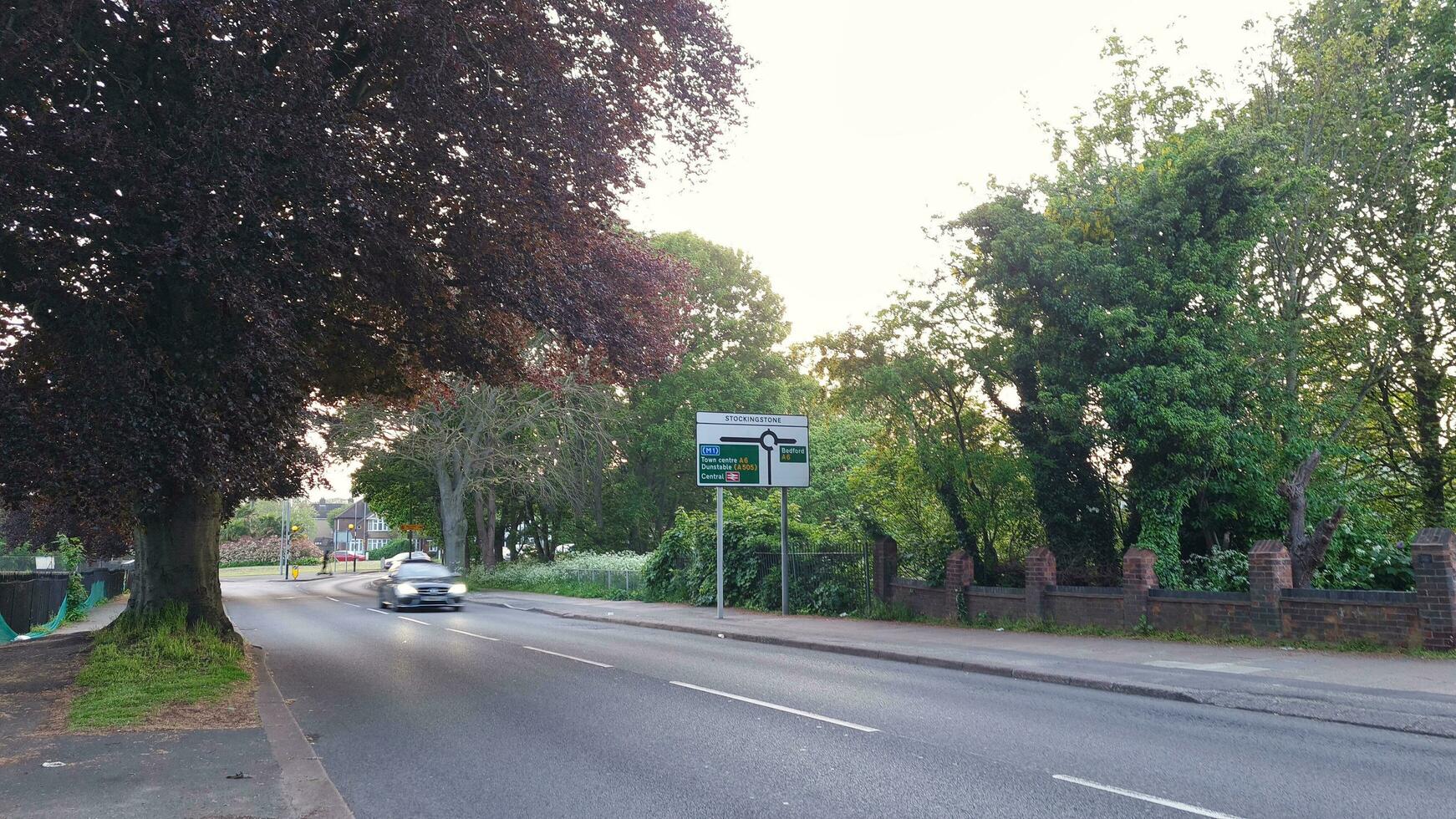 Low Angle View of British Town and Road during Sunset on May, 19th, 2023. Luton, England, UK photo
