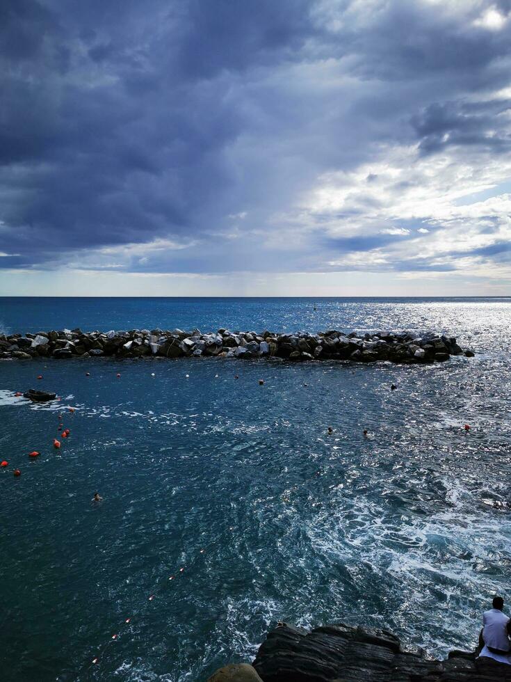 Photo of a tranquil lake with scattered rocks
