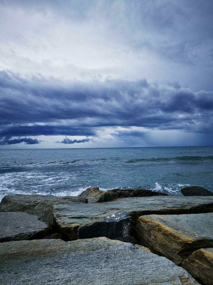 Photo of the ocean viewed from a rocky shore