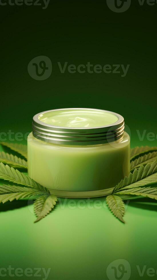 Moisturizing cream in jar with hemp leaves on blurred background. photo