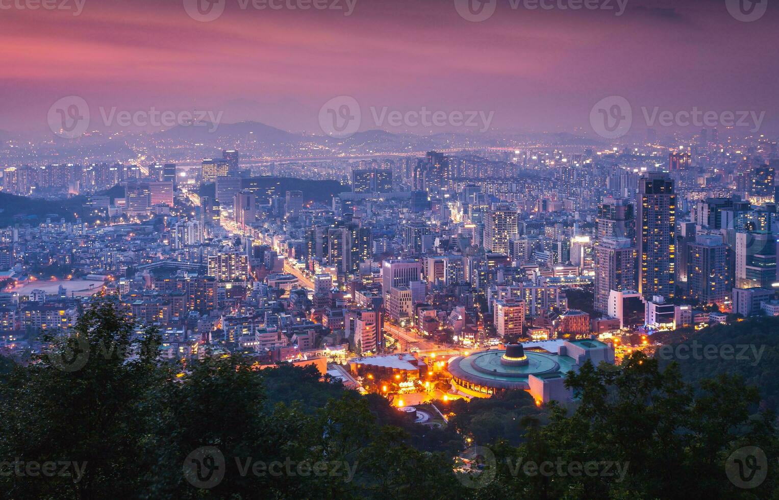 Seoul City skyline and downtown and skyscraper at night  is The best view and beautiful of South Korea at Namhansanseong mountain. photo