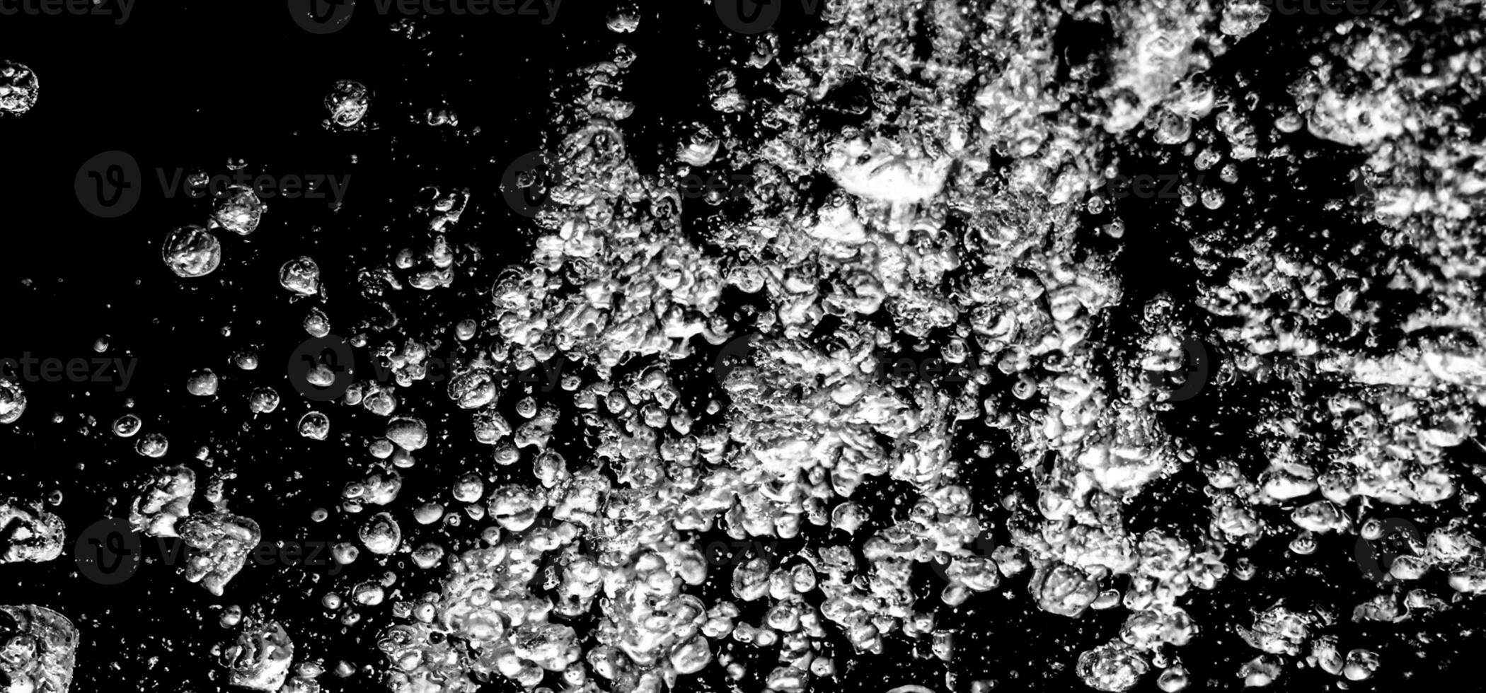 AI Generative Soda water bubbles splashing underwater against black background. photo