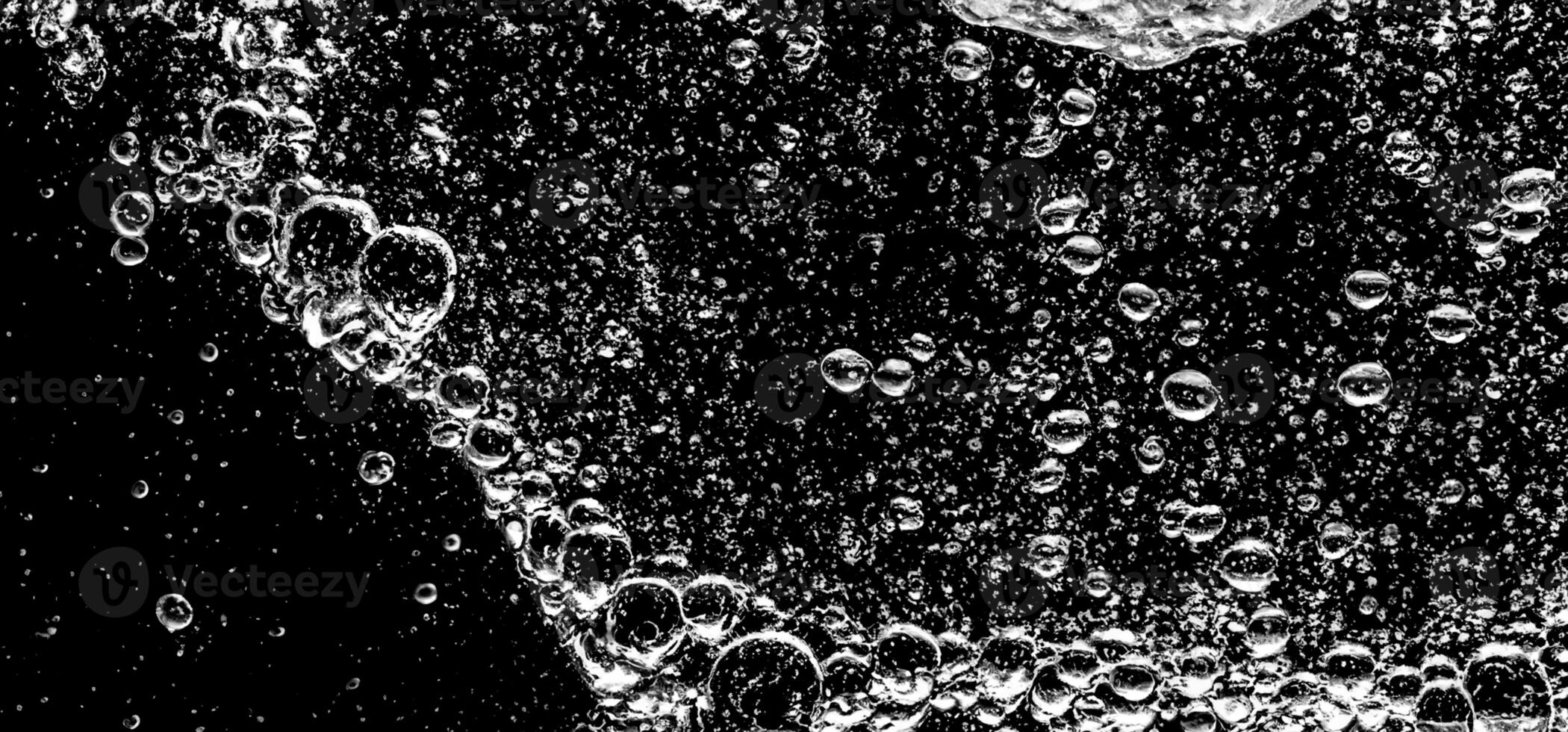 AI Generative Soda water bubbles splashing underwater against black background. photo