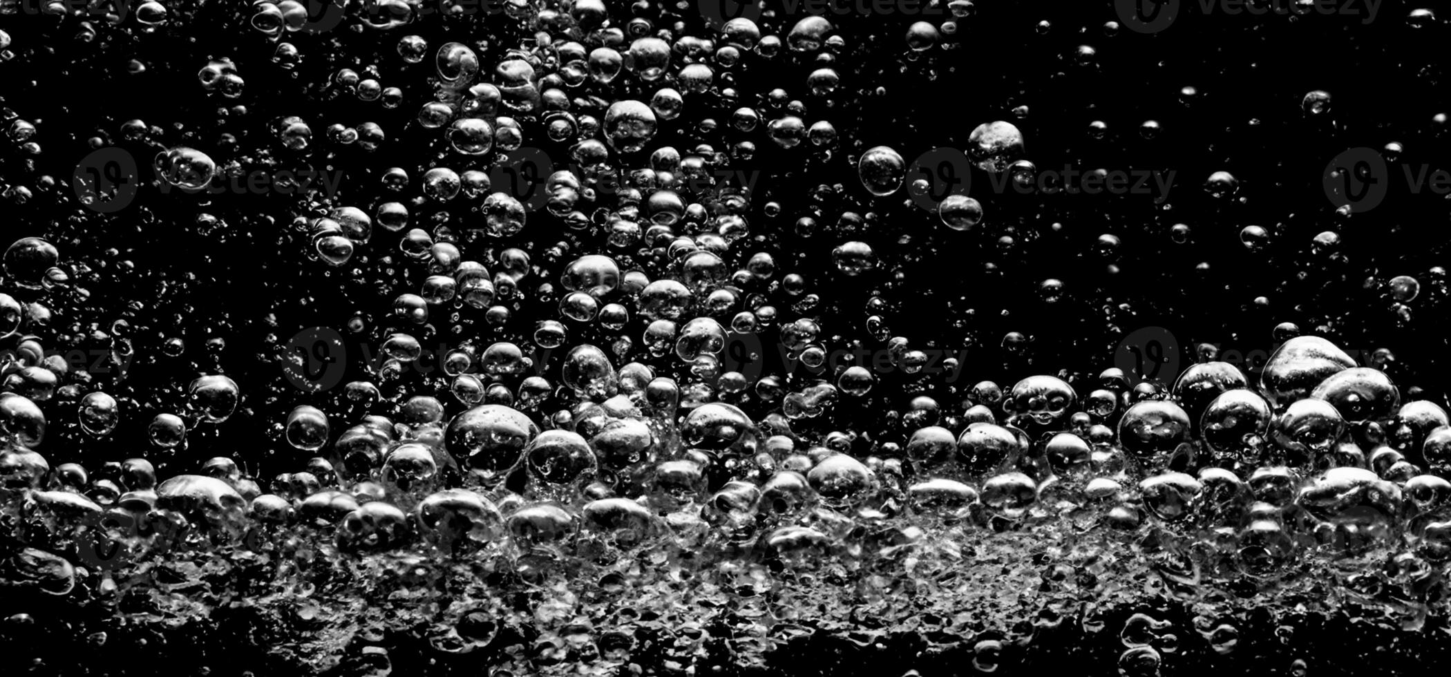 AI Generative Soda water bubbles splashing underwater against black background. photo