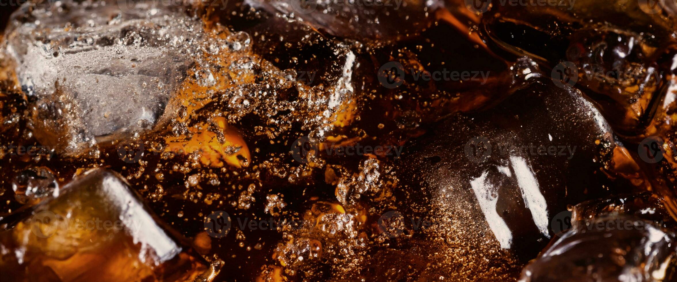 Cola soda and ice splashing fizzing or floating up to top of surface photo