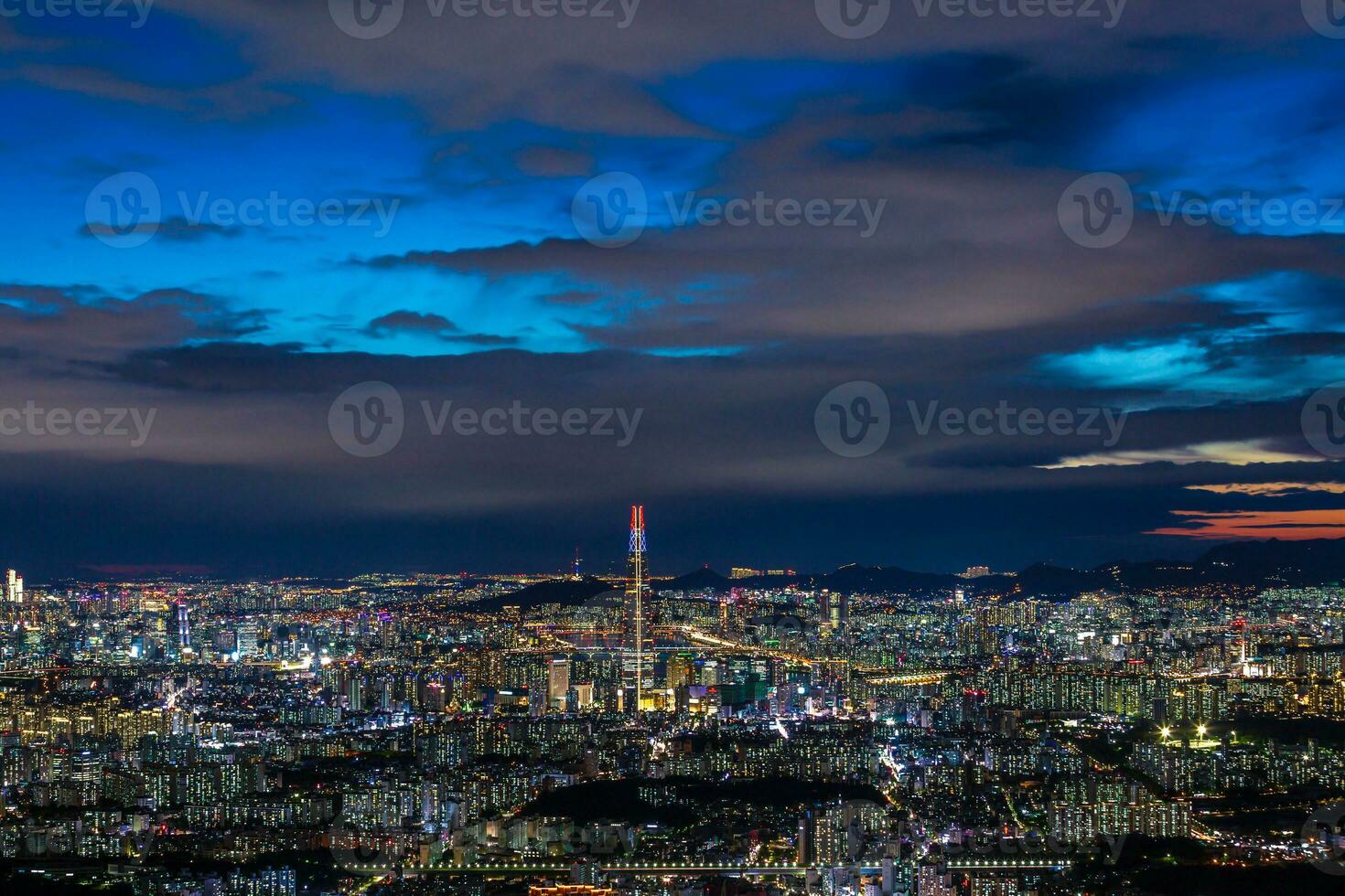 Seoul City skyline and downtown and skyscraper at night  is The best view and beautiful of South Korea at Namhansanseong mountain. photo