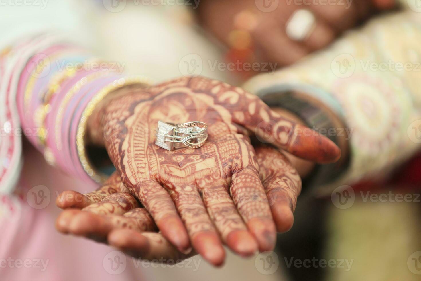 The bride and groom hands holding and showing wedding  Rings photo