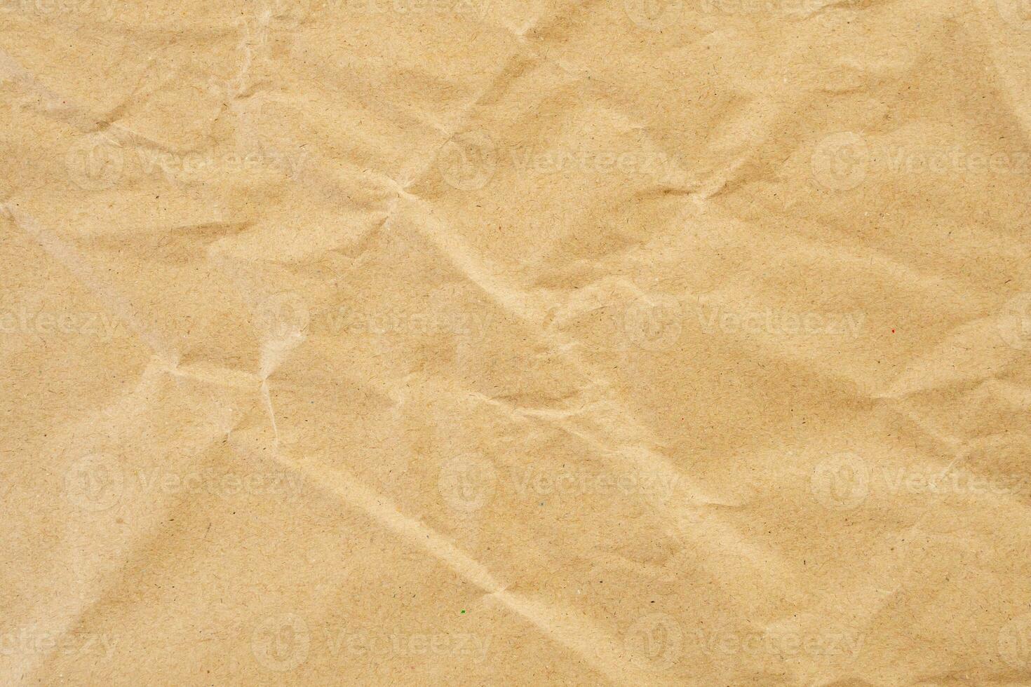 Abstract brown crumpled creased recycle paper texture background photo