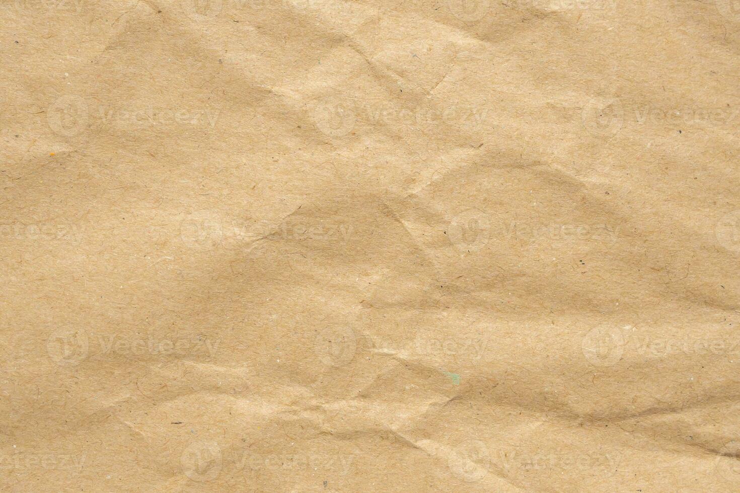 Abstract crumpled and creased recycle brown paper texture background photo