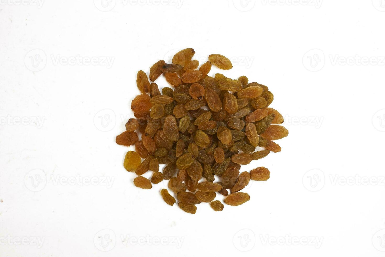 Dried golden raisins isolated on white background. Black Raisins or Kismis are a great snack option with good range of nutrients that can be added to the diet photo