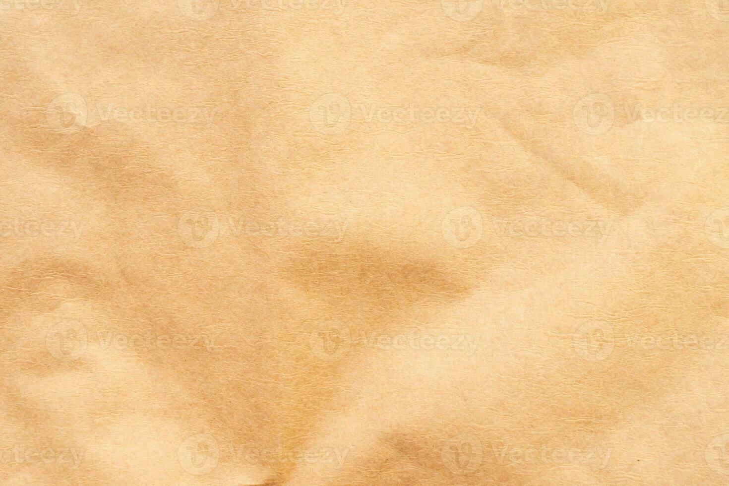 Abstract crumpled and creased recycle brown paper texture background photo