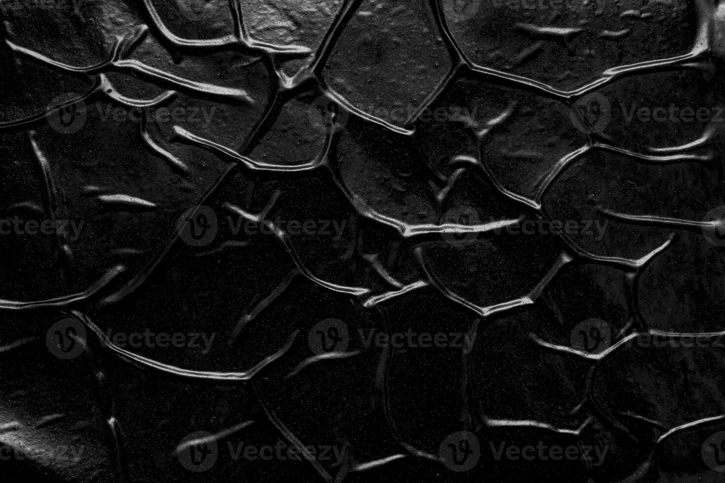 black crumpled and creased plastic poster texture background photo