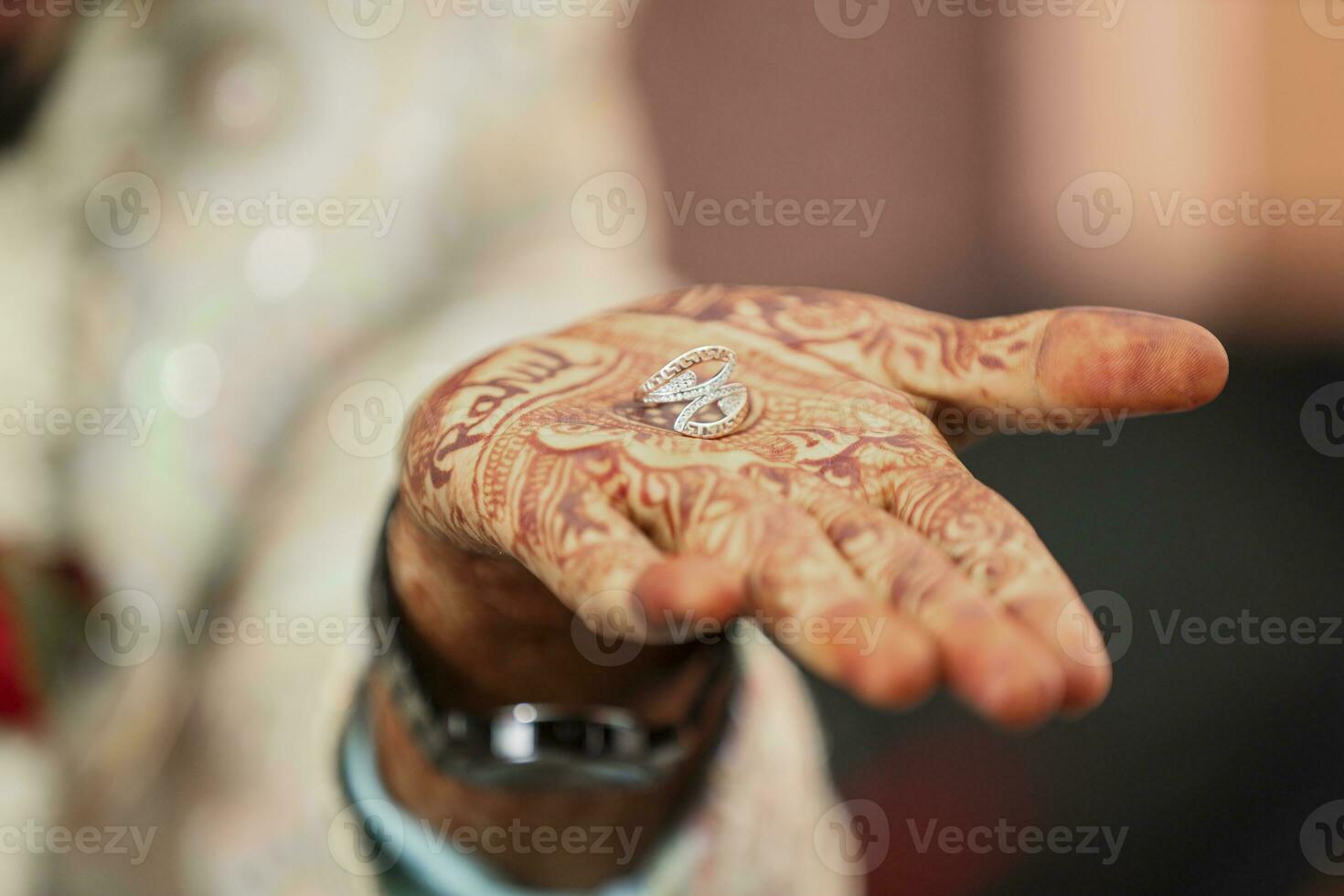 The bride and groom hands holding and showing wedding  Rings photo