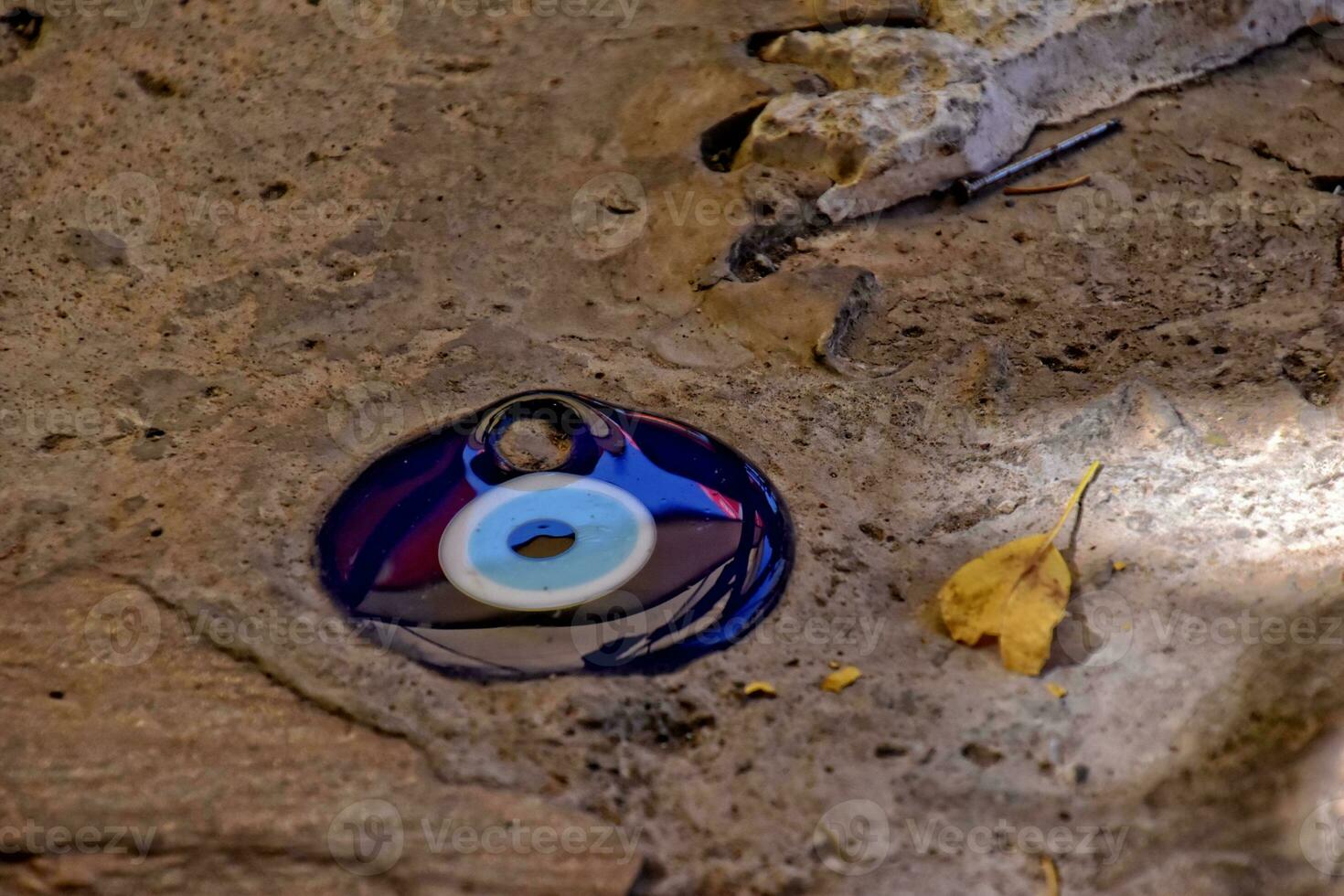 blue eye of prophet superstition protection symbol on pavement background in turkey photo