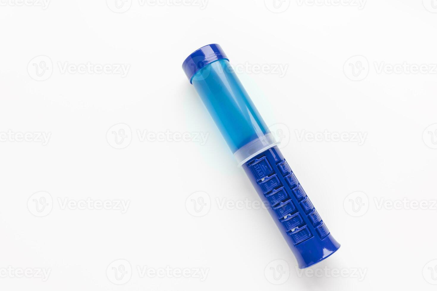 Fresh toilet cleaner gel on white background. Blue stamp wc cleaning dispenser. Closeup, copy space photo