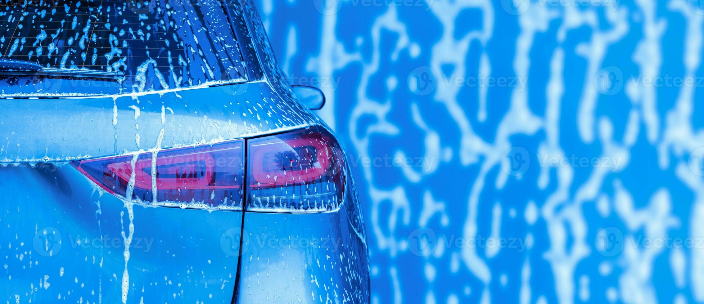 car cleaning and washing with foam soap background photo