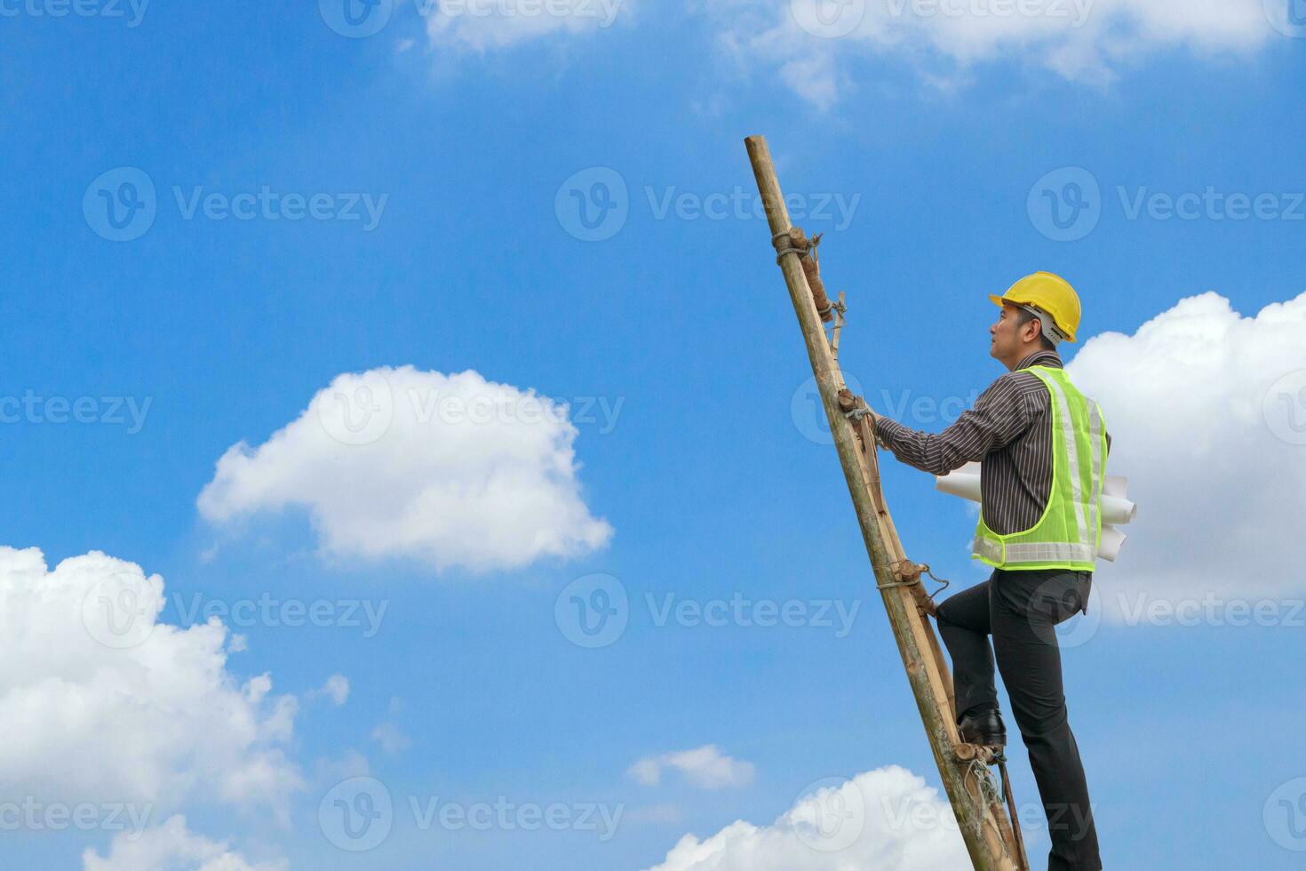 Asian business man engineer climbing up ladder with blue sky, career growth and success concept photo