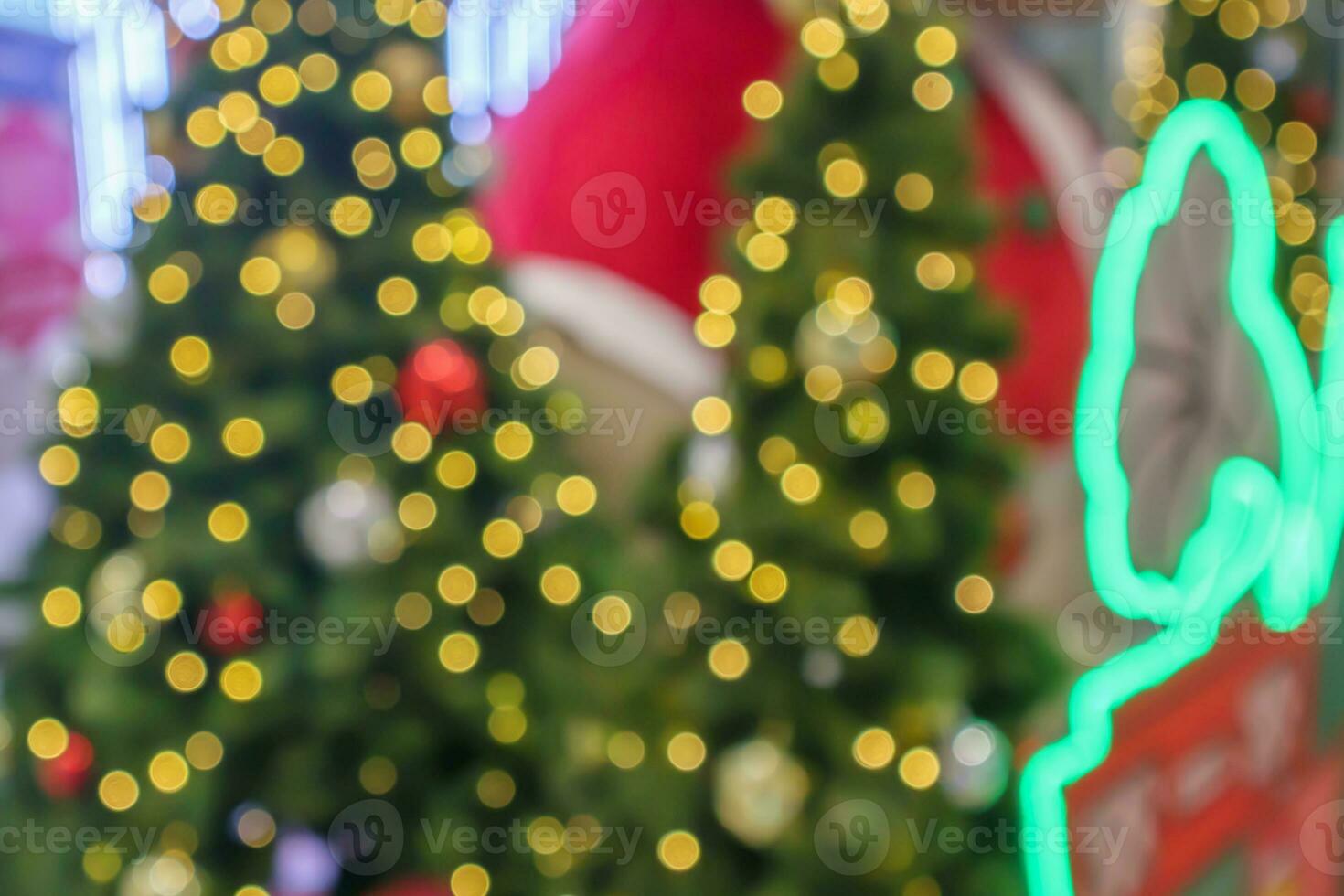 Abstract blurred christmas tree with bokeh light background photo