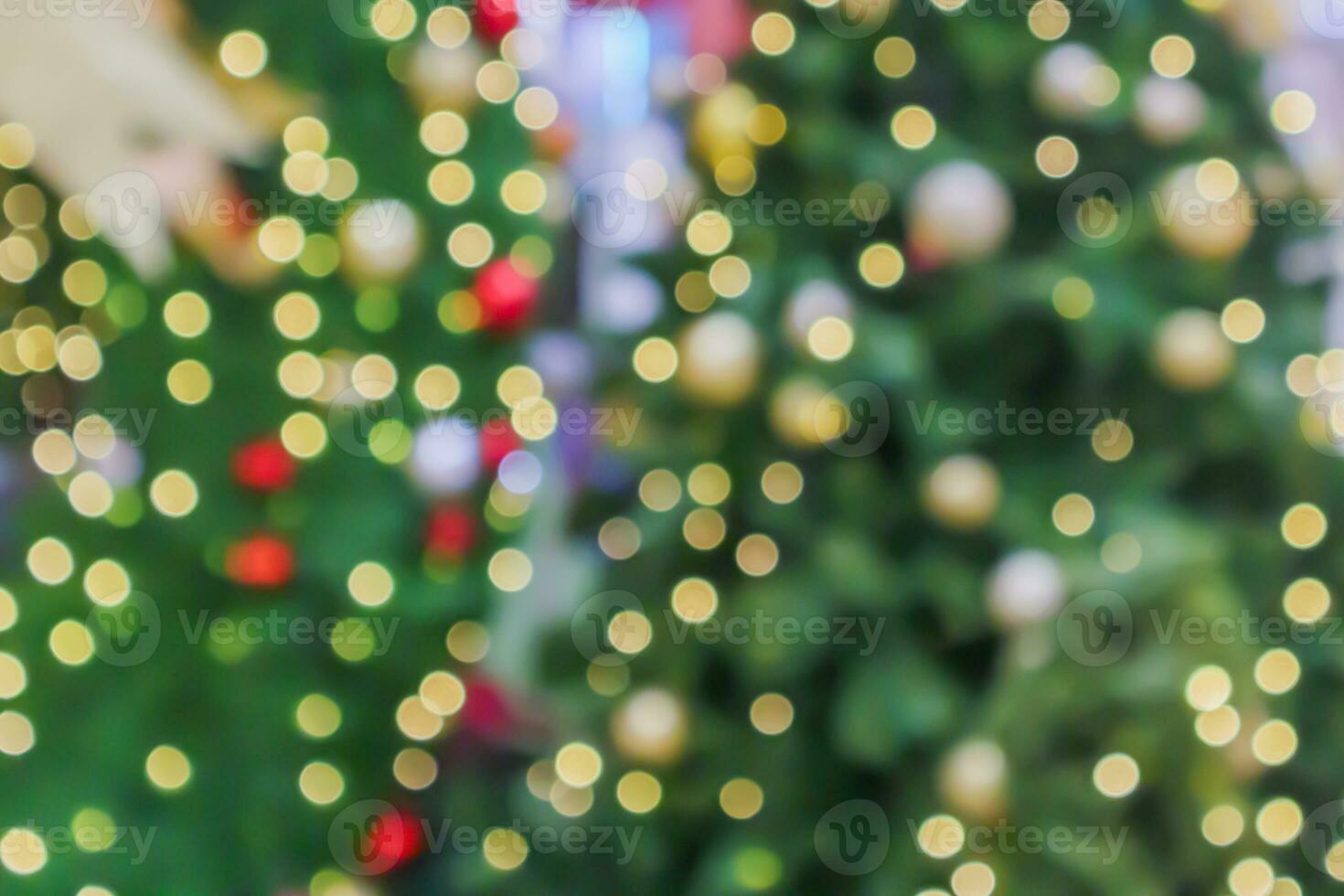 Abstract blurred christmas tree with bokeh light background photo