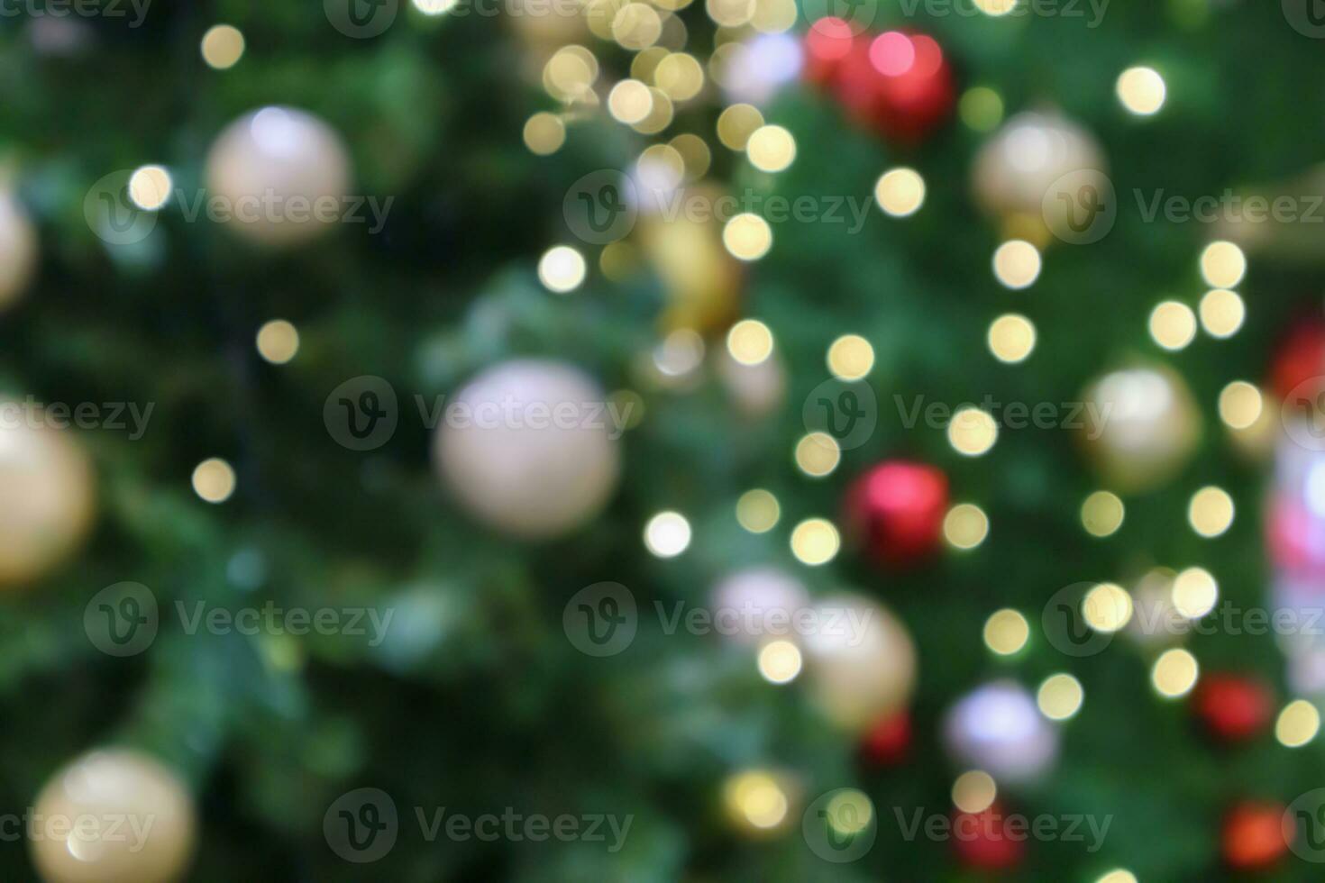 Abstract blurred christmas tree with bokeh light background photo