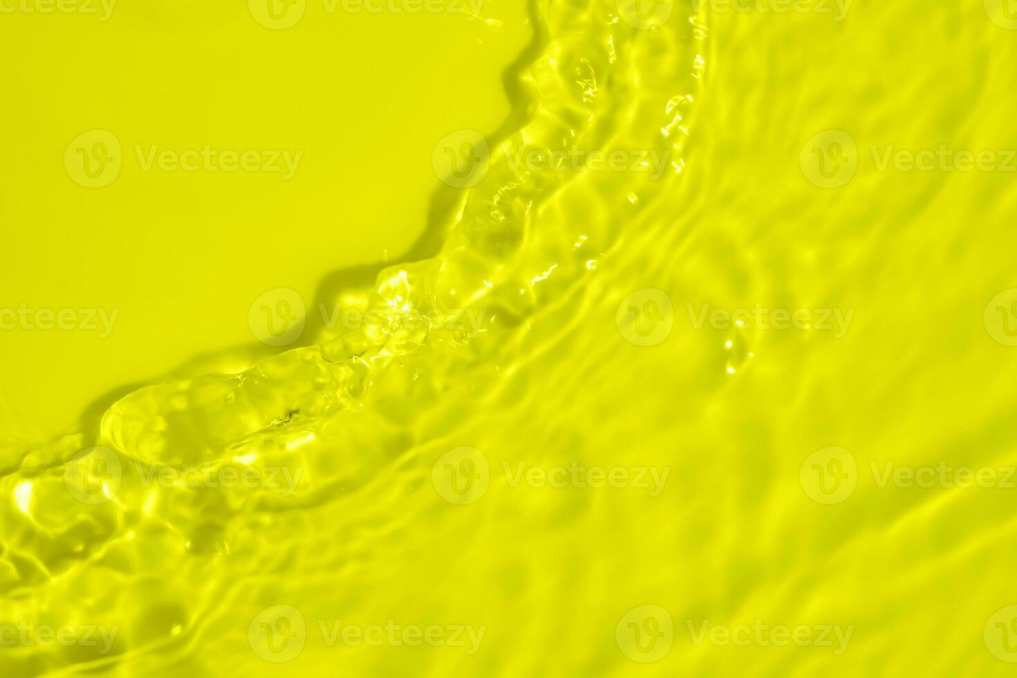 Abstract transparent water shadow surface texture natural ripple on yellow background photo