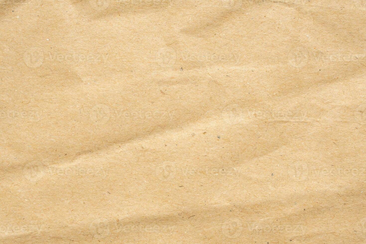 Abstract crumpled and creased recycle brown paper texture background photo